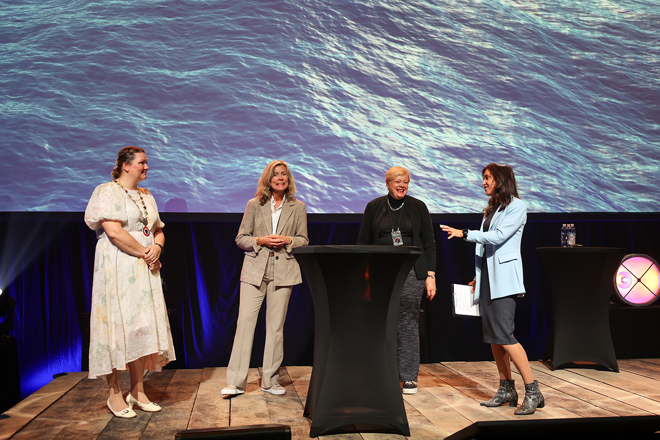 four women on stage