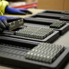 A Stena Recycling employee sorting some electronics.