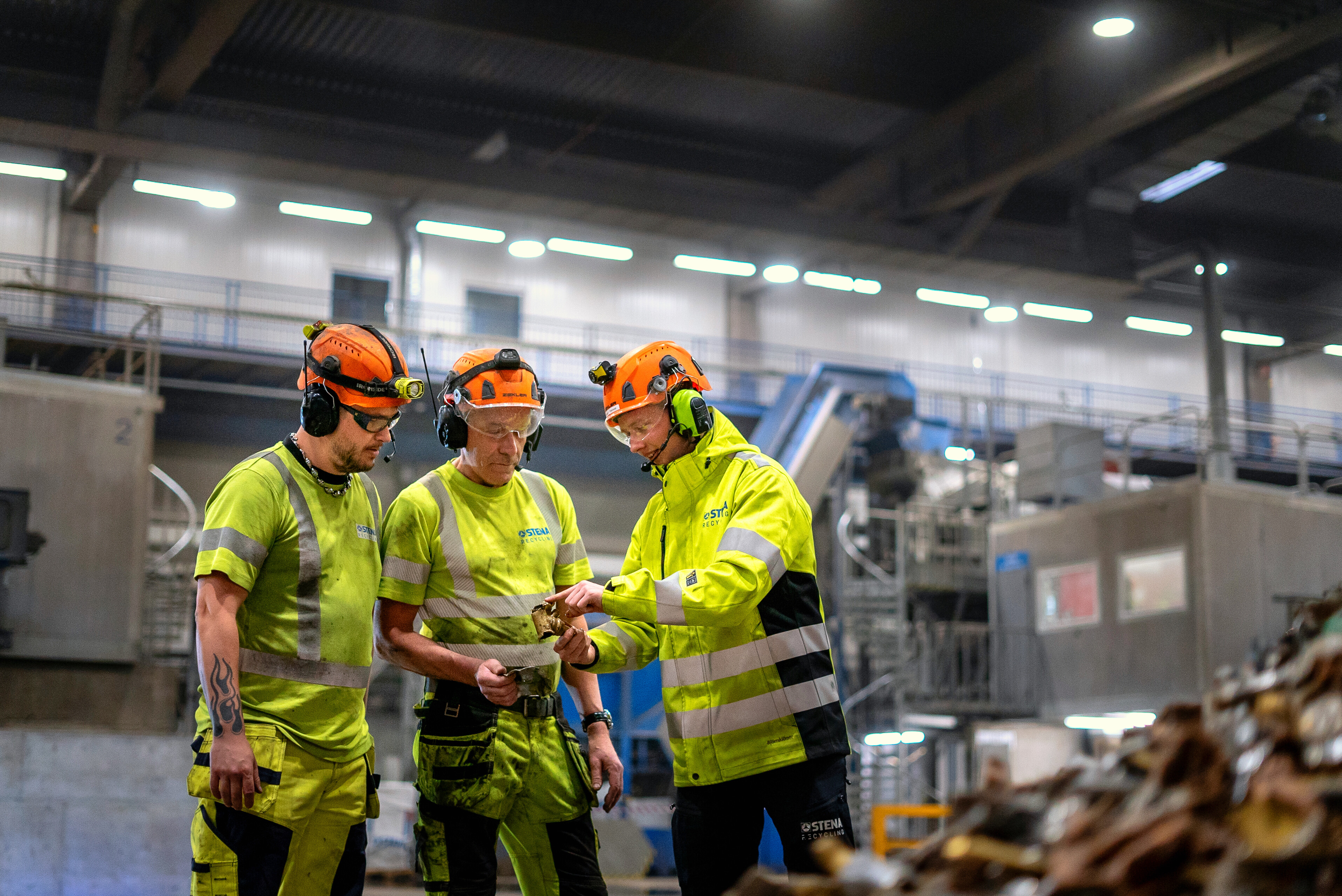 thre men talking in production