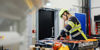 woman handling a car battery