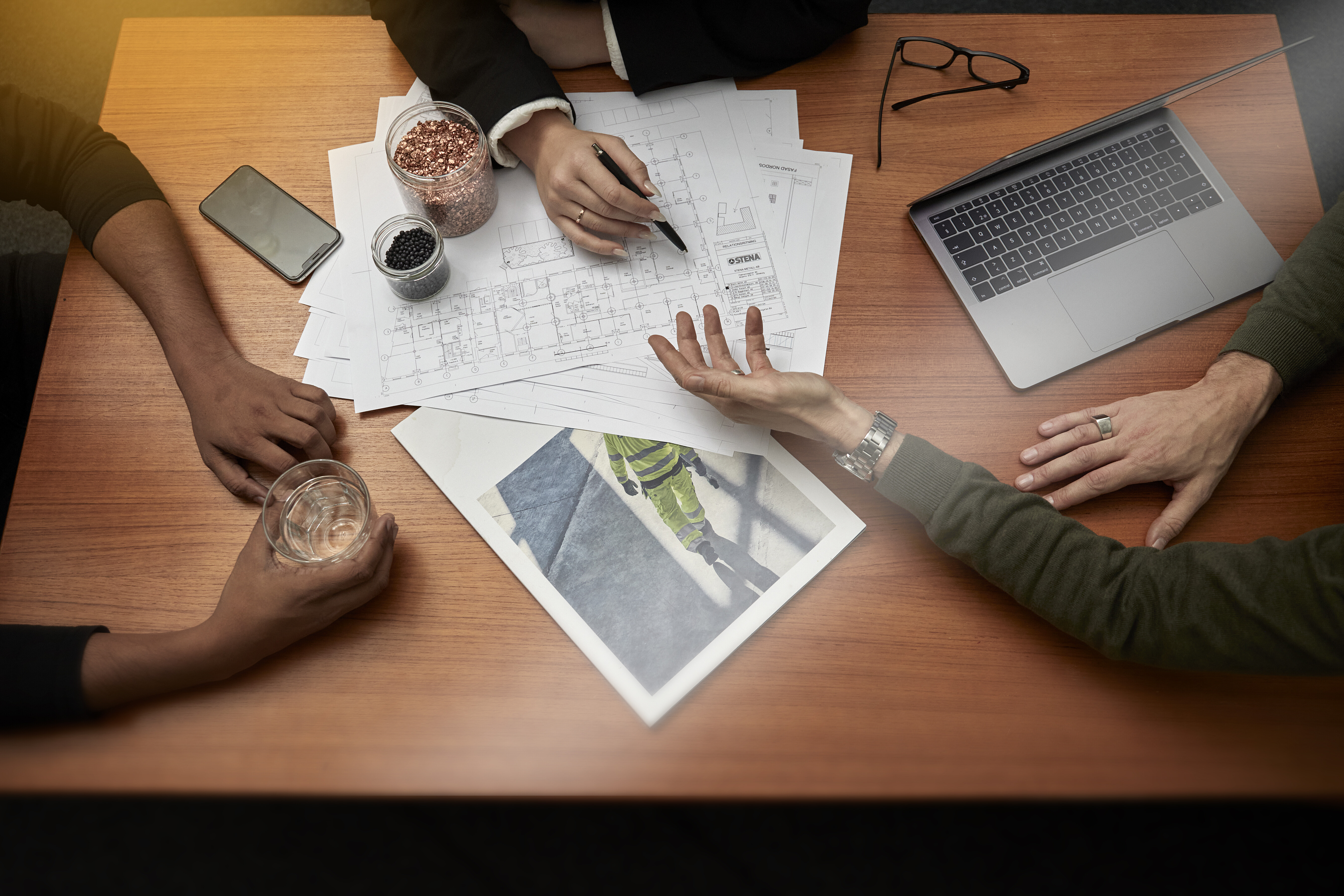 hands and documents on a table