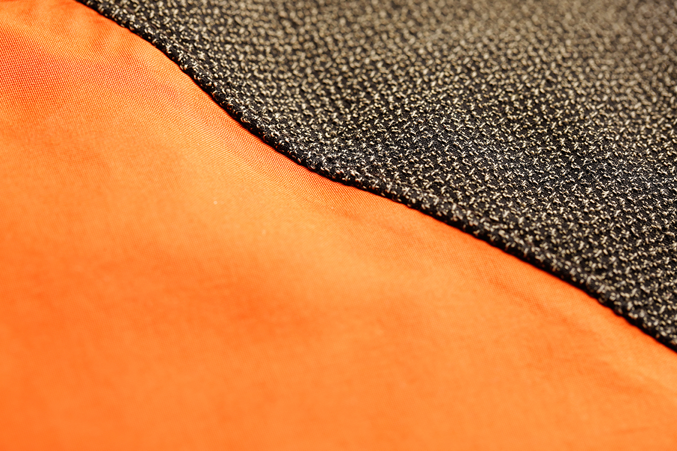Detailed shot of vibrant orange and black fabric