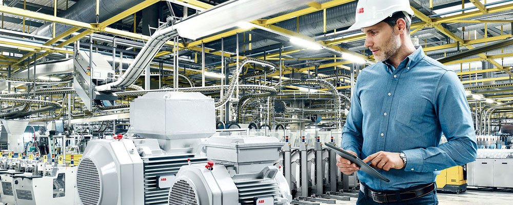 Man in hat looking at machine
