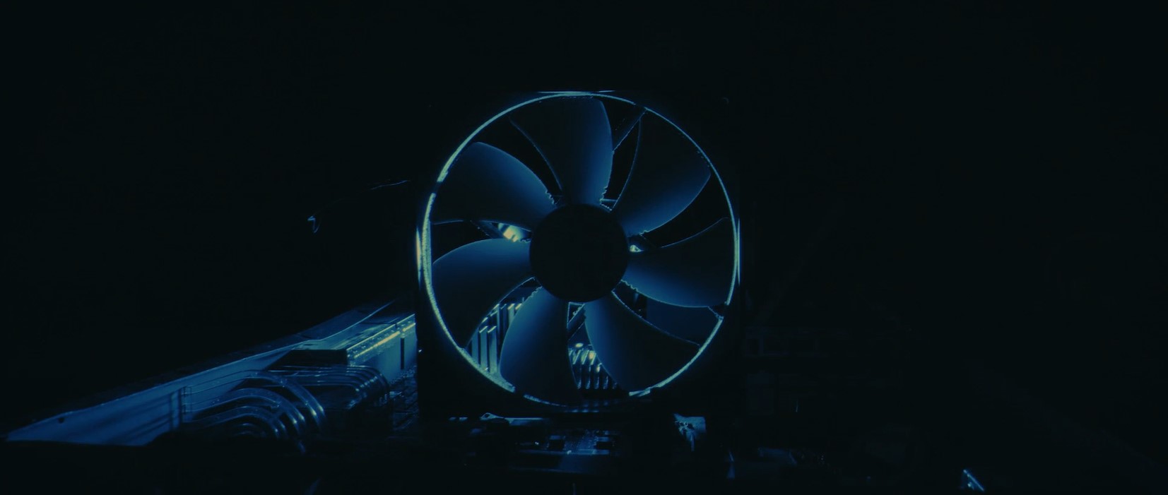 A dimly lit computer fan