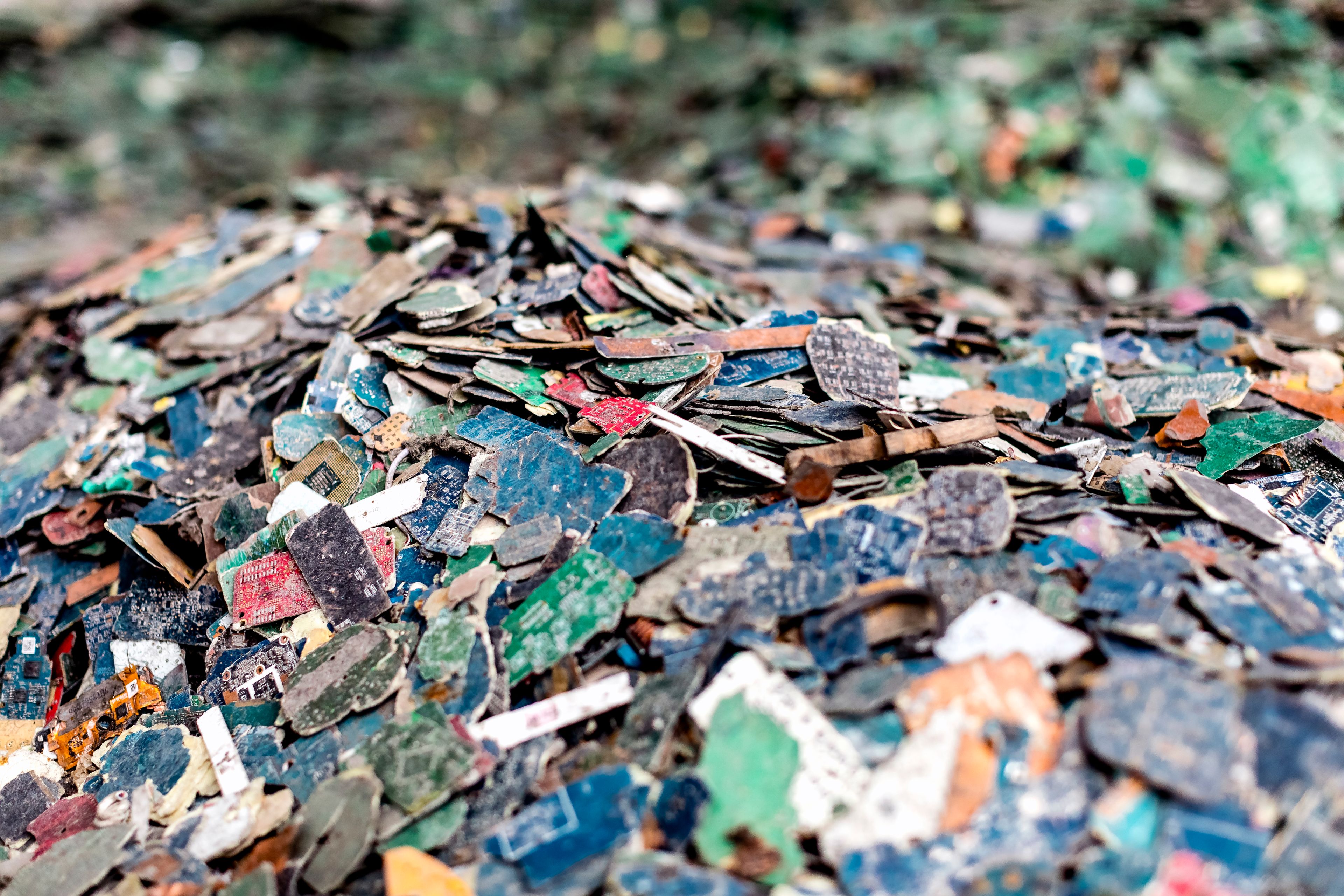 A close-up of a pile of electronic waste.