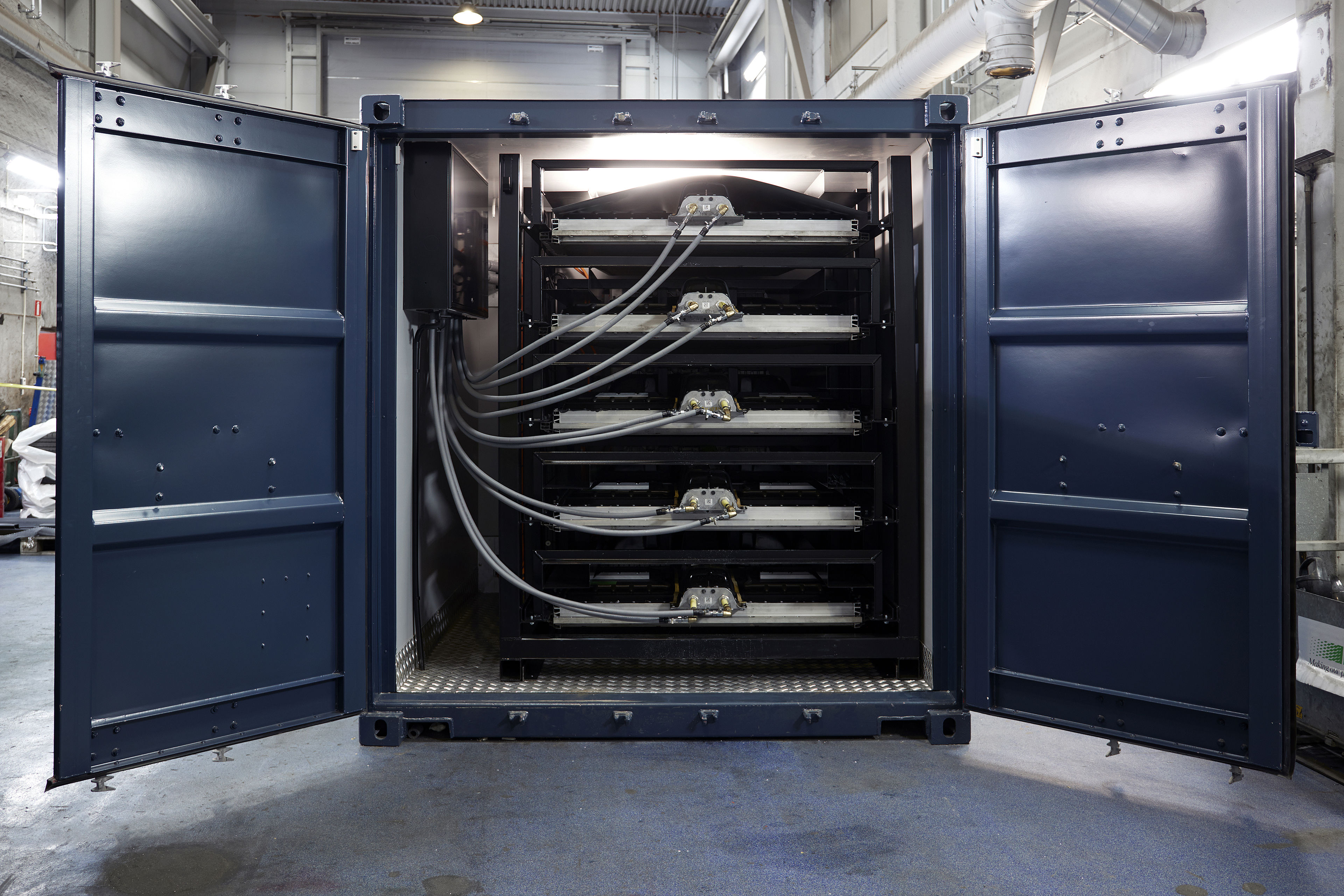 Used vehicle batteries being reused to power an energy storage system.